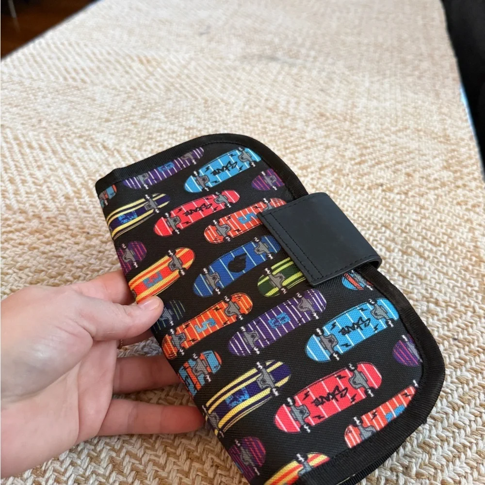 ZIPIT brand fanny pack or hip pouch, featuring a vibrant skateboard pattern